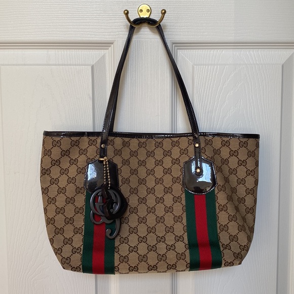 Authentic Gucci brown monogram canvas tote!With three charms.Near perfect! - Picture 8 of 14